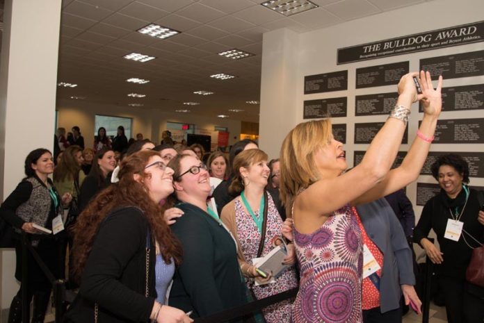 EAGER FANS: Hoda Kotb of NBC News, the luncheon speaker at the 2015 Women's Summit, pauses to take a selfie with people who signed up for her book signing, before leaving campus. / COURTESY PAM MURRAY